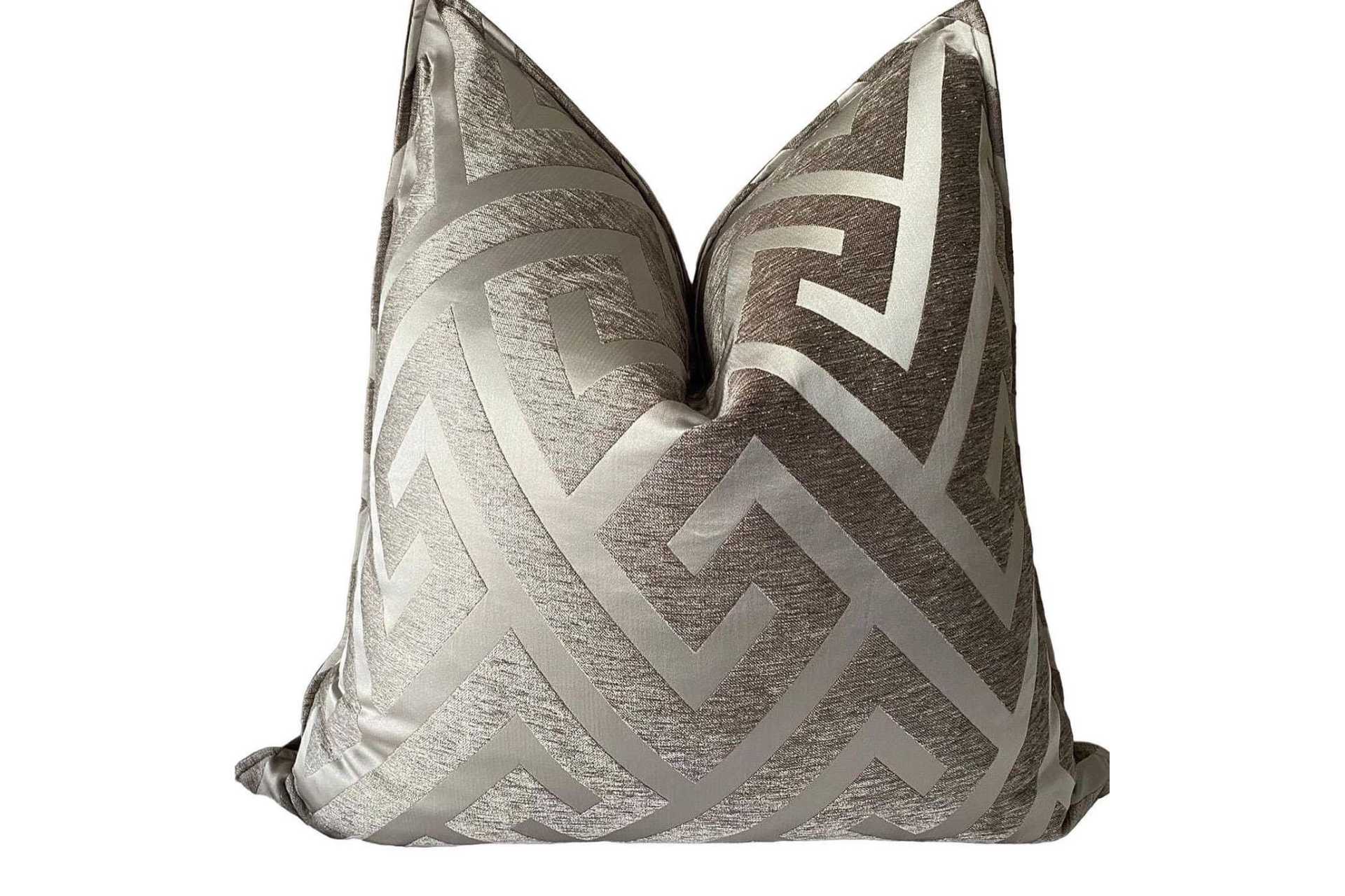 Bronze scatter cushion with geometric design