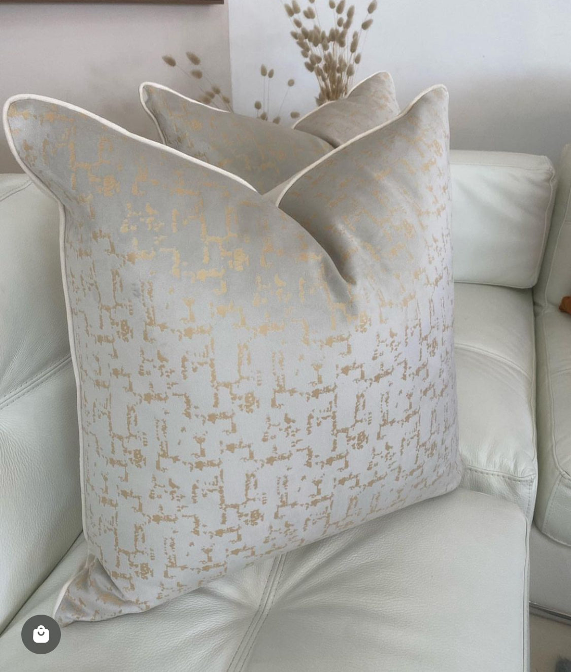 luxury scatter cushion in ivory and gold tones with elegant piping detail