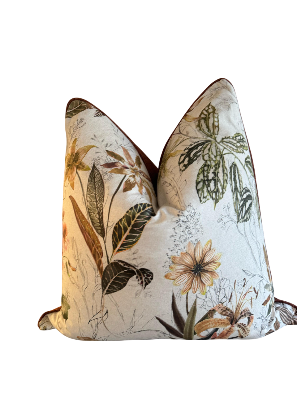 Luxury scatter cushion with elegant piping detail, in a floral pattern fabric with early colour tones.