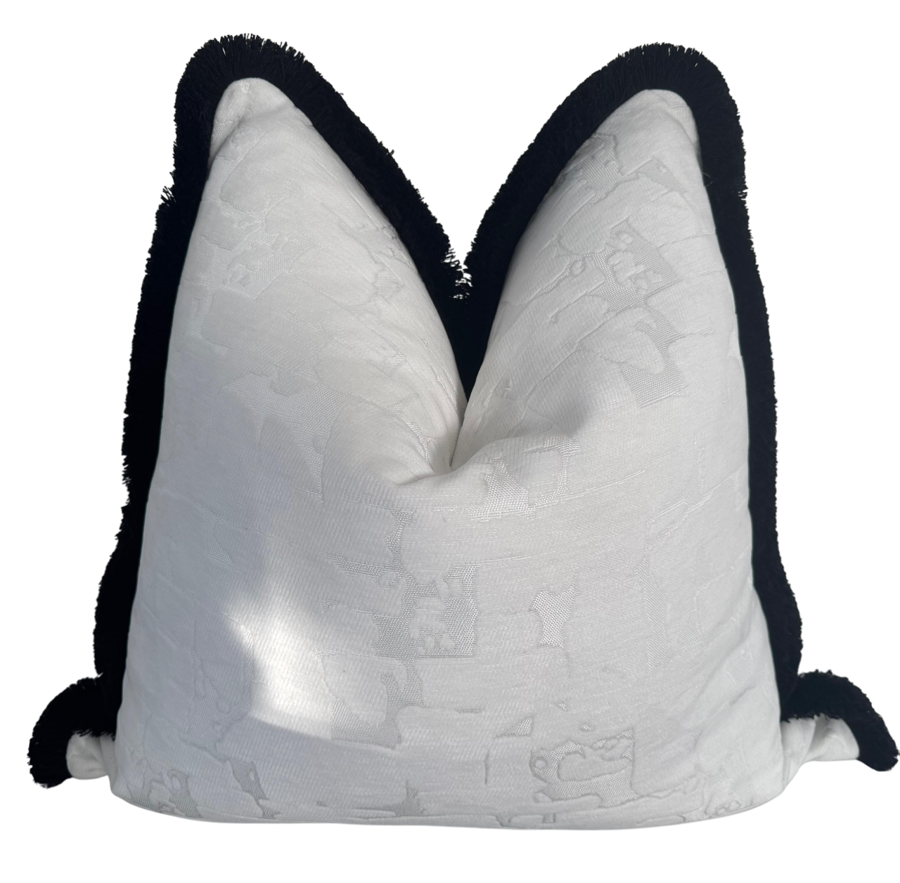luxury fabric cushion in white fabric with black tassels
